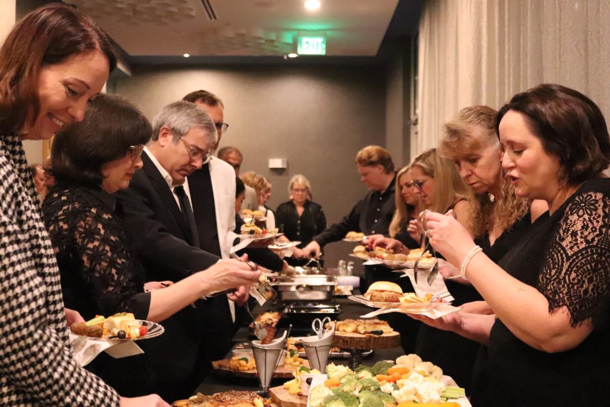 At the Black and White Gala, guests enjoy a diverse buffet featuring a variety of delicious foods on Saturday at Aloft Dallas Hotel in Coppell. The guests come together to support Coppell Theater’s fundraising efforts and help bring excitement to the event. Nidhi Medicharla
