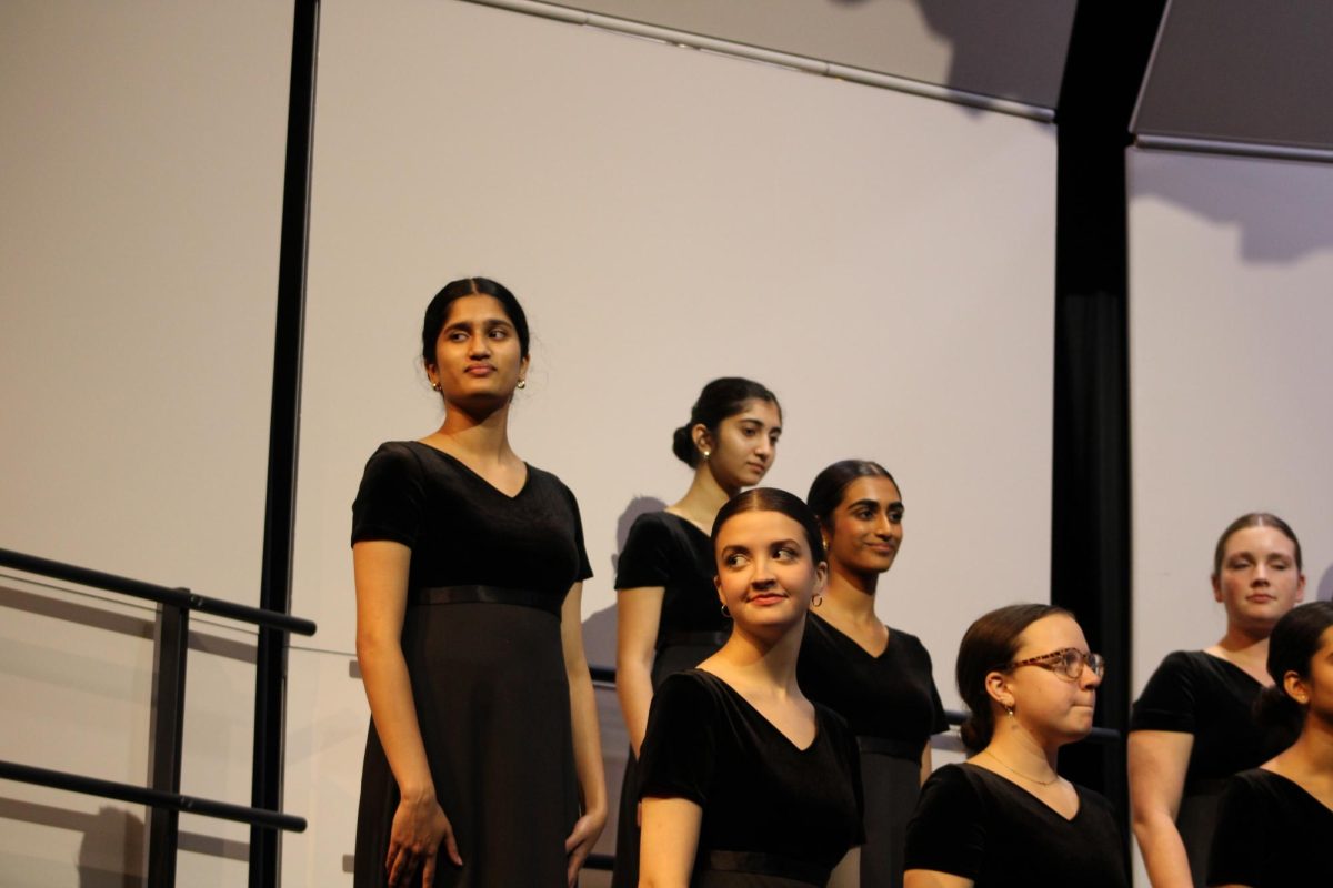 Coppell High School combined Varsity Treble Choir seniors Minori Kunte, Ishana Sharma, Saanvi Mantena, Rebekah Liebert and Lynlee Graves perform a song at the Fall Concert.  Coppell Choir held its Fall Concert on Oct. 15 in the CHS Auditorium. Photo by Leana Paradis
