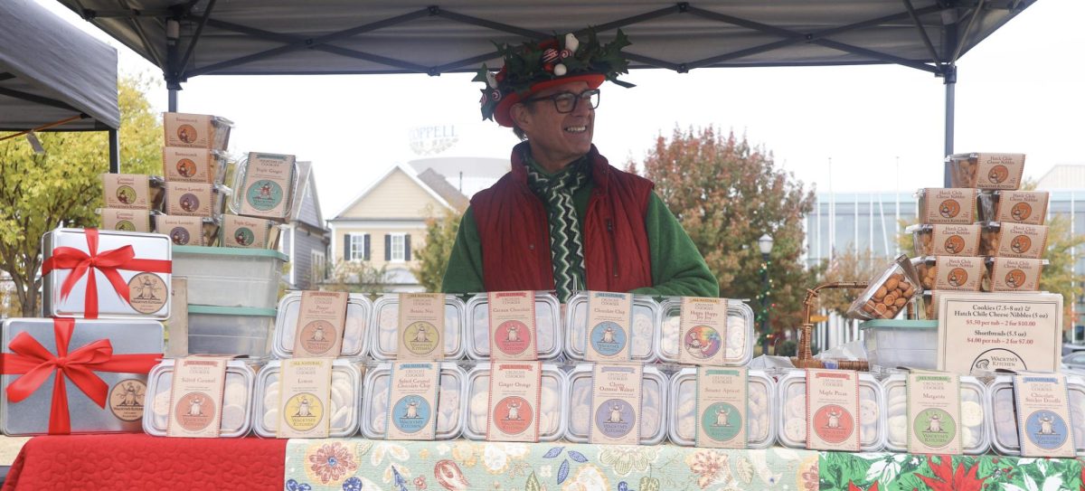 Wackym’s Kitchen owner Paul Wackym sells cookies at Old Town Coppell on Dec. 7.  Vintage Christmas at Old Town Coppell is an annual event celebrating the holiday season with shops, crafts and treats. 
