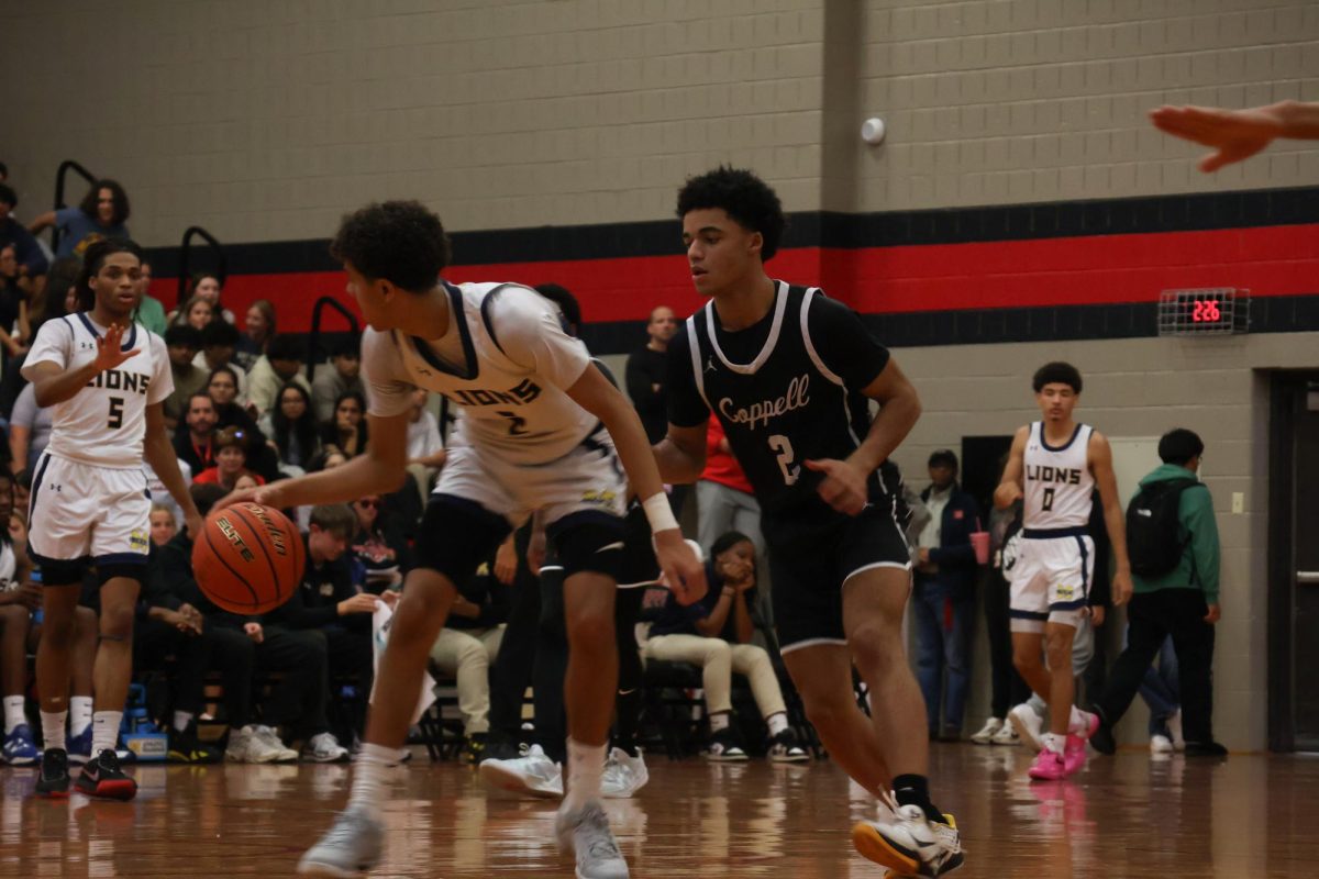 Coppell junior guard Isaiah Fleming defends McKinney junior point guard Braden Givens at CHS Arena on Nov. 22. Coppell plays Richardson at 7:30 p.m. Tuesday at CHS Arena. Photo by Marli Field.