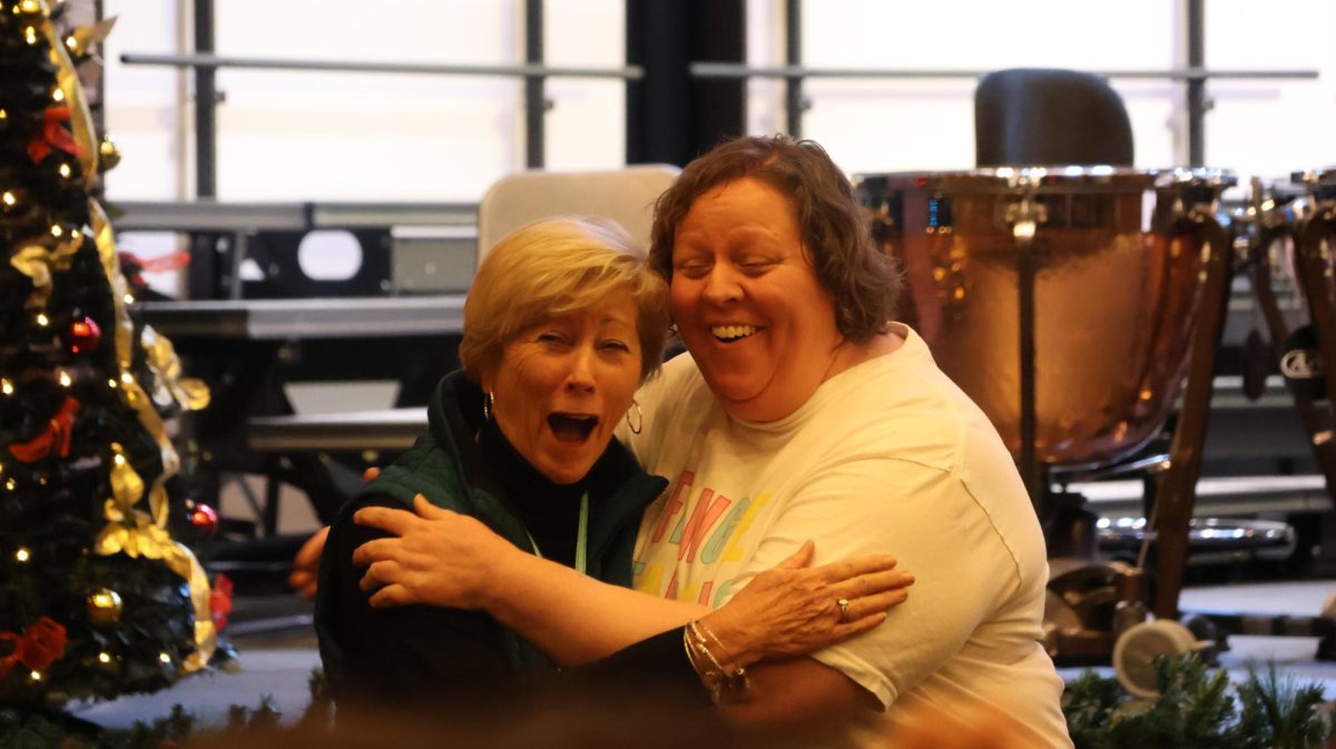 Coppell High School Principal Laura Springer congratulates English teacher Kim Pearce on her receipt of the 2024-25 Teacher of the Year honor. Pearce was named the Teacher of the Year at Thursday’s staff meeting for her dedication to the CHS community. Photo by Sohana Singh