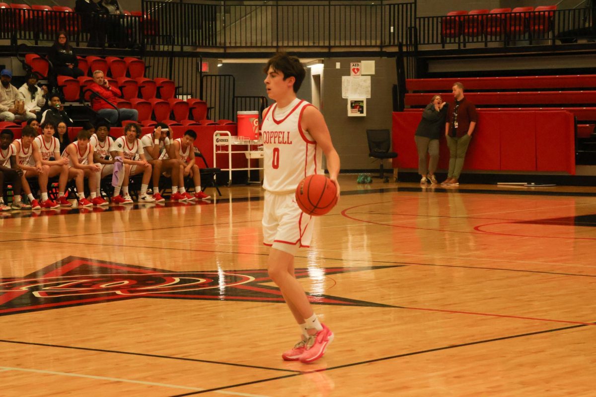 Coppell senior guard Bryce Ward brings the ball up for Coppell as it defeated Frisco Centennial, 75-59. The Cowboys host their first District 5-6A game Tuesday in CHS Arena at 7:30 p.m. against Little Elm.