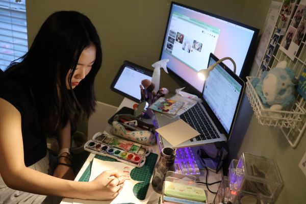 Coppell High School junior Jiwoo Choi works on an envelope order in her room on Dec. 5. Choi owns JiwoosCorner, a small business selling customized envelopes and stickers on Etsy.