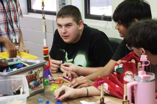 CHS9 LEGO Club president Sean Gooden builds a LEGO tower during hour block lunch on Nov. 20. Gooden created LEGO Club to provide students with an environment to relax during the school day. Photo by Sukirtha Muthiah