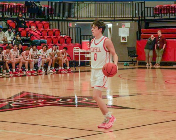 Coppell senior guard Bryce Ward brings the ball up for Coppell as it defeated Frisco Centennial, 75-59. The Cowboys host their first District 5-6A game Tuesday in CHS Arena at 7:30 p.m. against Little Elm. Photos by Maanav Subramanian.