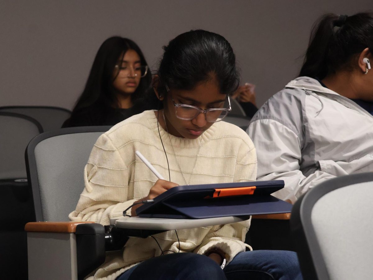 Coppell High School senior Vaishnika Pagadala sits in the Lecture Hall during her 4th period release on Nov. 22. Students are now required to stay in the Lecture Hall or return home during their release period to prevent them from roaming the hallways.