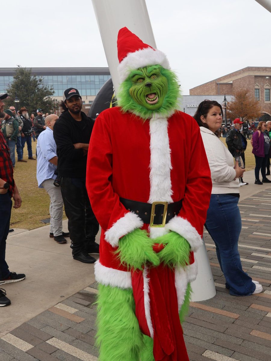 Tony Leyva dresses up as the Grinch at the Texas Toy Run to bring out holiday spirit at the Sound on Sunday. The 10th annual Texas Toy began with a motorcycle ride escorted by the Fort Worth Police Department and ended at The Sound to collect donations and toys for children of My Health My Resources and Metrocare Dallas.