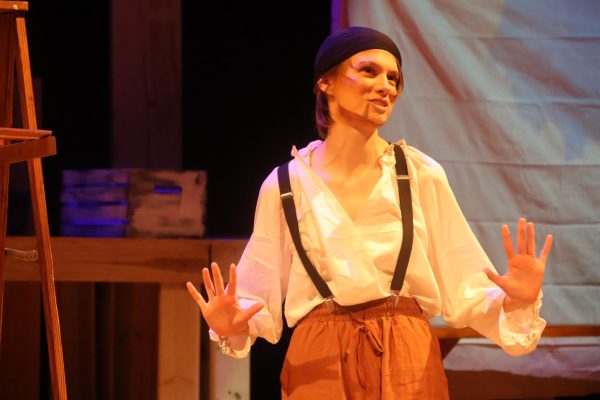 New Tech High @ Coppell sophomore Sam Foster, playing Llewellyn in “The Old Man and The Old Moon,” shares stories with crew in the Coppell High School Black Box Theatre during dress rehearsal on Nov. 13. The Cowboy Theatre Company Black Box Productions ran “The Old Man and the Old Moon” from Nov. 14-16.