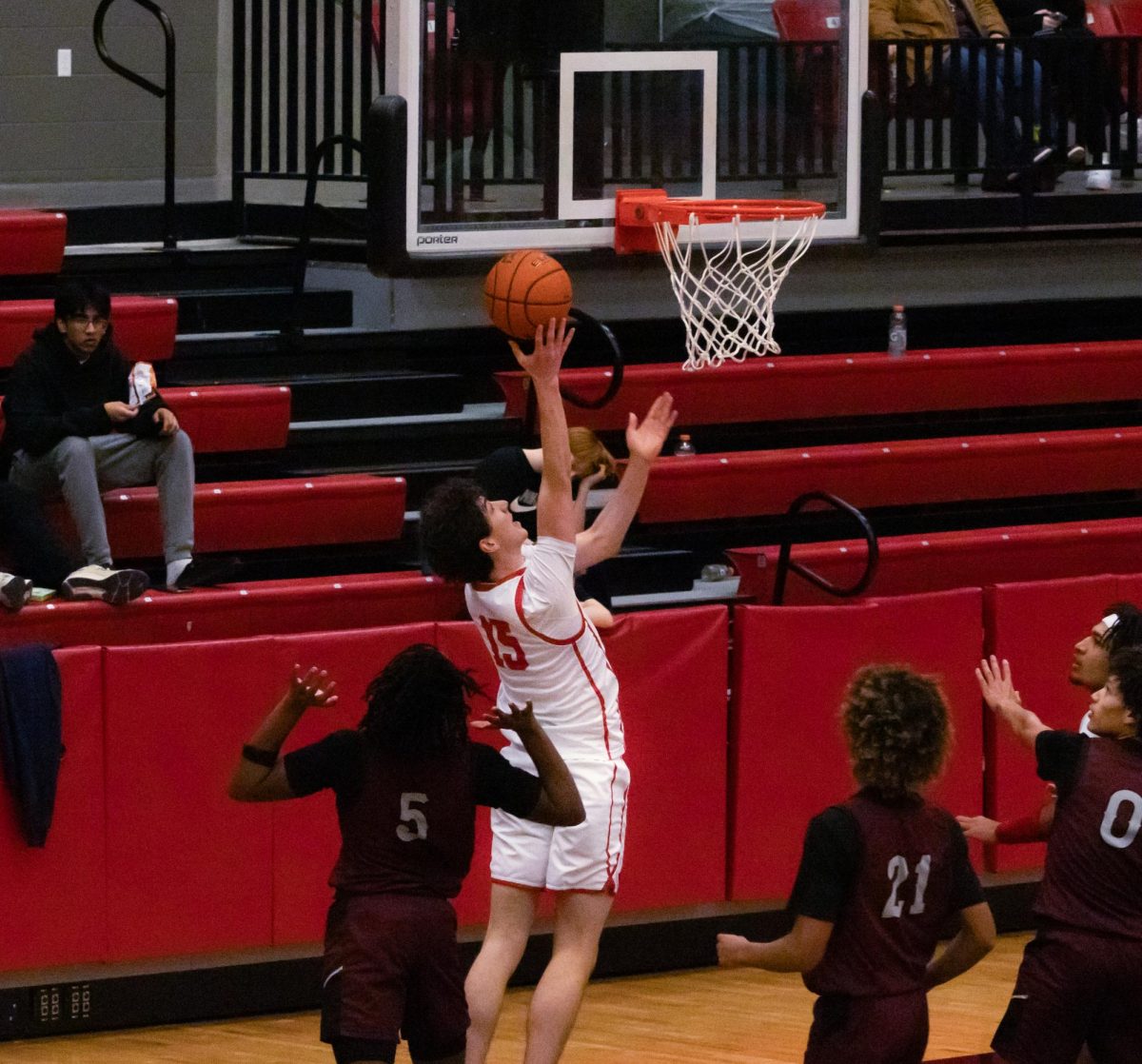 Coppell junior guard Collin Griffith shoots a layup against Lewisville on Friday at the CHS arena.