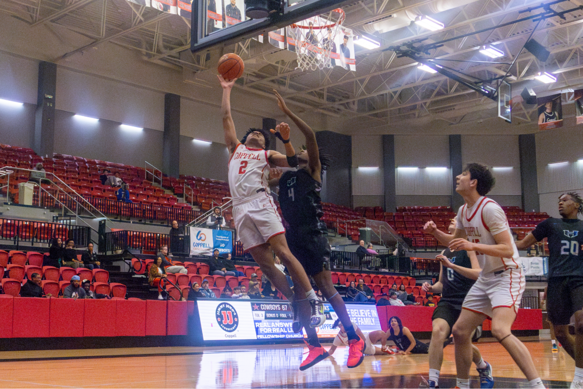 Coppell junior guard Isaiah Fleming scores a layup at CHS Arena on Tuesday. The Cowboys play Denton Guyer in the CHS Arena at 7:30 p.m. on Friday. 