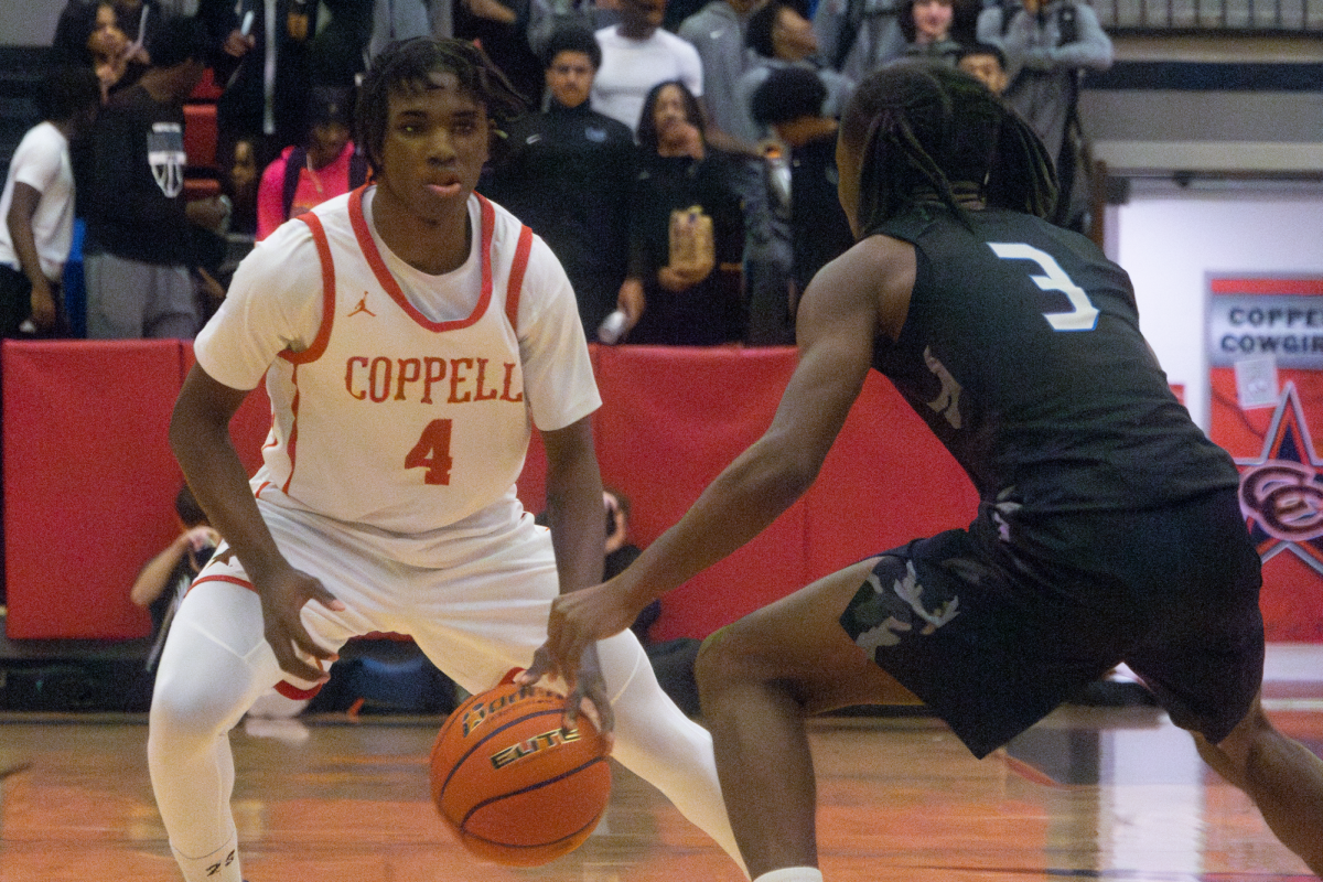 Hebron senior point guard J'Lyn Jenkins guards Coppell sophomore guard Robert Watson at CHS Arena on Tuesday. The Hawks defeated the Cowboys in overtime, 83-81.