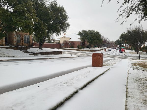 Snow pelts the streets of Valley Ranch in Irving on Thursday. All Coppell ISD buildings are closed Thursday and Friday due to hazardous conditions brought by winter weather.
