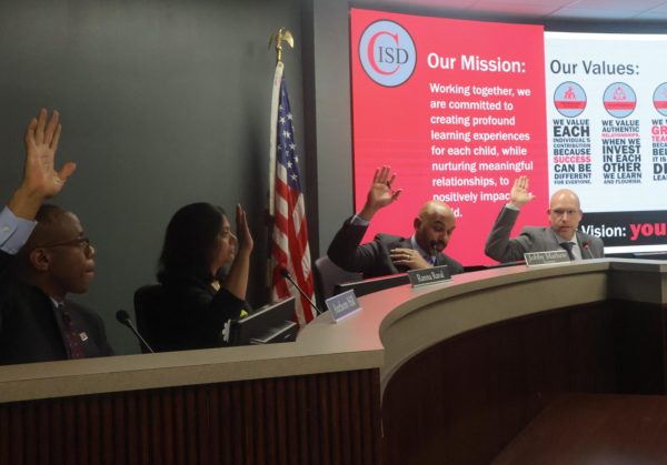 The Coppell ISD Board of Trustees votes unanimously for the replacement of Coppell High School’s Indoor Facility’s artificial turf at the School Board meeting on Monday at the Vonita White Administration Building. The board approved refreshers and furniture replacements to multiple campuses. Photo by Raima Awan