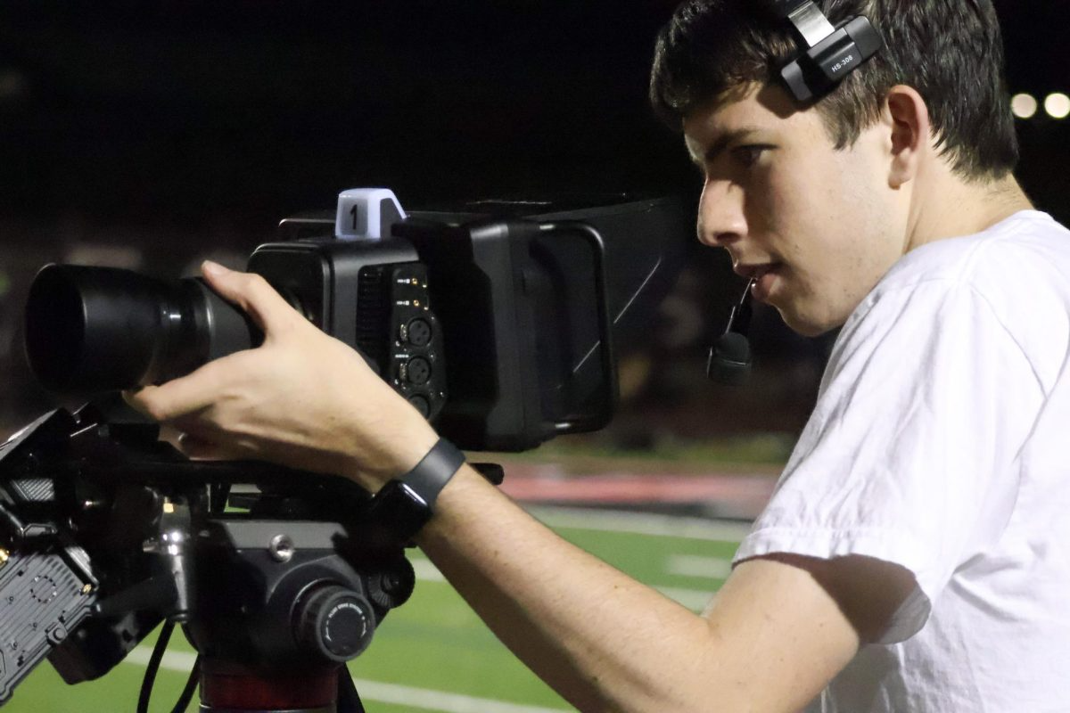 KCBY-TV senior program director Jack Mancuso films Coppell’s home football game against Little Elm at Buddy Echols Field on Oct. 11. As campus newsrooms celebrate Scholastic Journalism Week, Coppell High School student journalists produce vital content to keep the community informed.