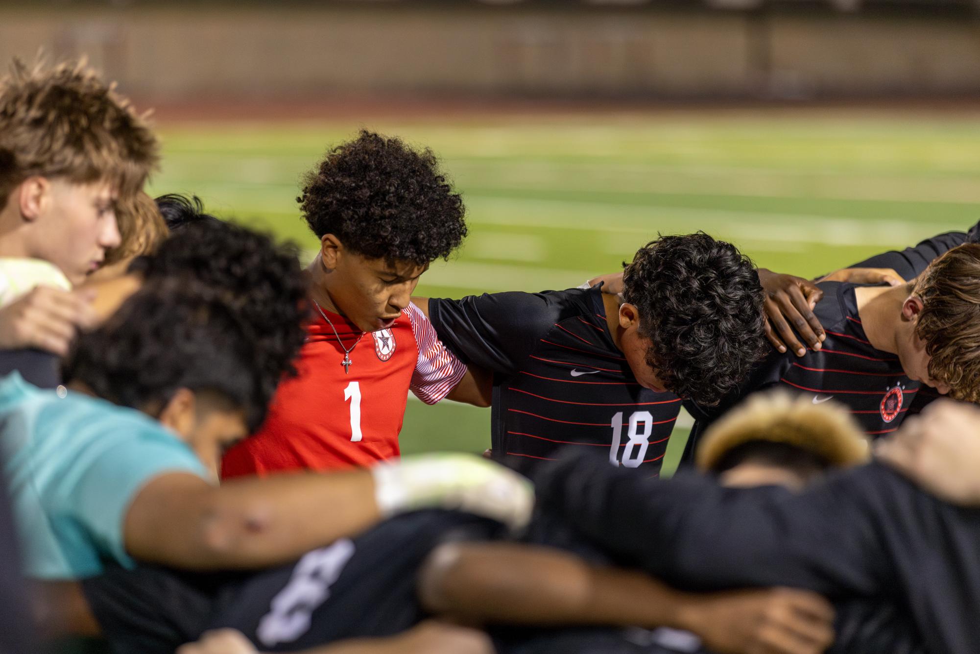 Coppell junior goalkeeper Chase Anderson leads a prayer before the match on March 7 at Buddy Echols Field. The Coppell boys soccer team emerged as District 5-6A champions for the first time in nine years. Photo by Kayla Nguyen.