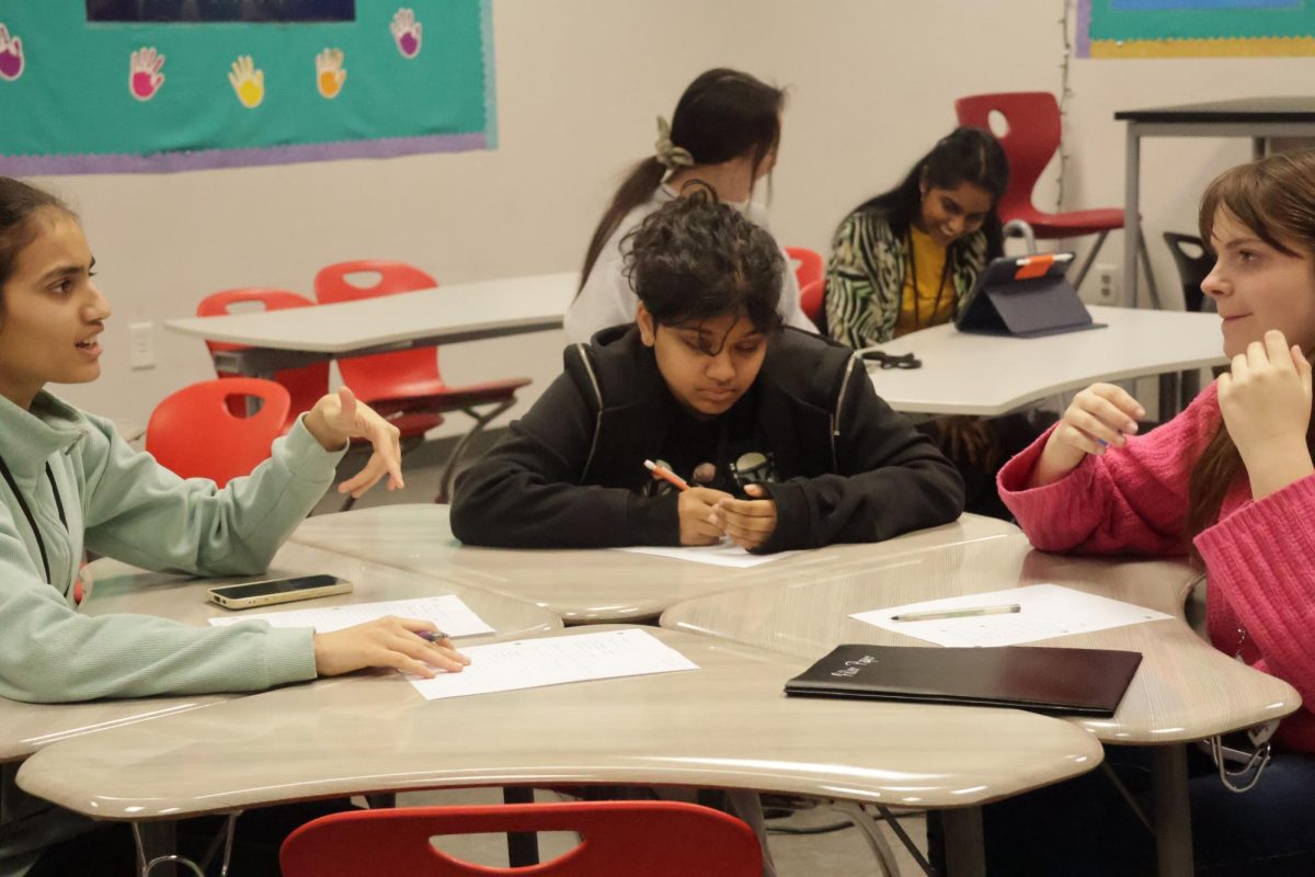 CHS9 students Eesha Jogdand, Olivia Rebello and Charlotte Heer evaluate an audition on Thursday. The American Sign Language (ASL) Club’s production of “Hansel and Gretel” incorporates sign language and spoken dialogue. 