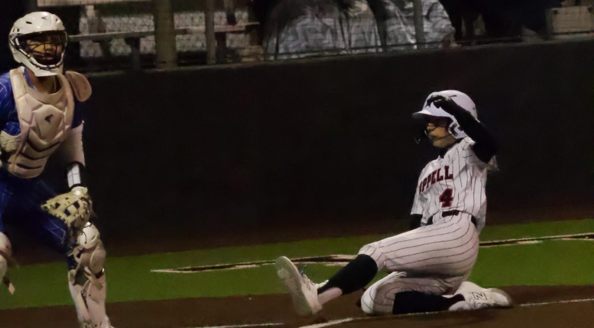 Coppell sophomore outfielder Courtney Hargrove into home plate to score the Cowgirls’ final run against Hebron on Wednesday at Coppell ISD Baseball/Softball Complex. Hebron beat Coppell, 6-3.