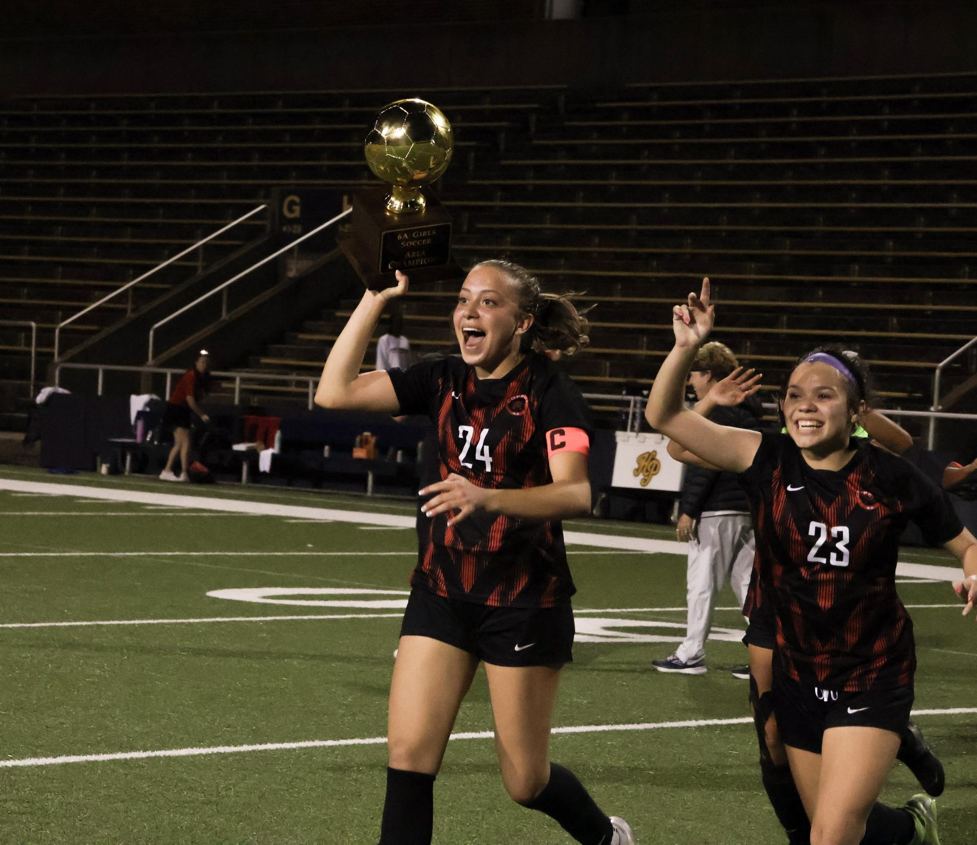Coppell senior defender Monica Morales-Martinez and senior defender Jordan Clig celebrate the Class 6A Division I Region I championship.The Coppell girls soccer team defeated Flower Mound, 1-0, on Tuesday at Max Goldsmith Stadium in the regional finals. Photo by Marli Field.
