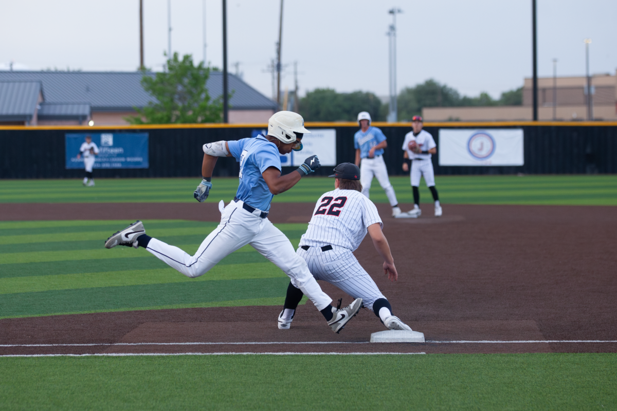 Flower Mound senior first baseman Jaden Love sprints to first base as Coppell senior infielder Joaquin Oaxaca attempts to catch a ground out at the Coppell ISD Baseball/Softball Complex on Thursday. The Cowboys fell to the Jaguars, 5-0. Photo by Sabah Uddin