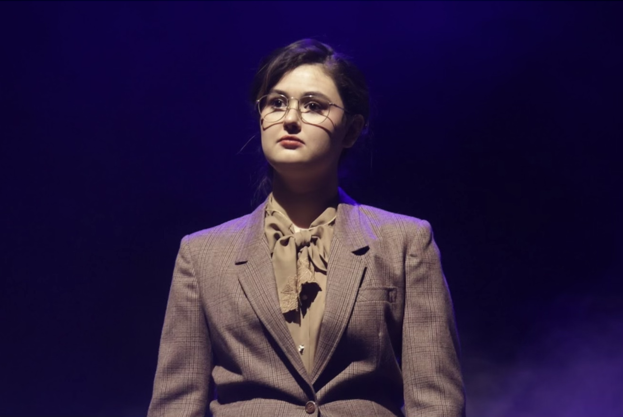Coppell High School senior Sophie Casewell, playing Corrie Ten Boom, speaks about the importance of holding onto hope during dark times in CHS varsity theater’s One-Act Play of “The Hiding Place.” Caswell plans to pursue acting and directing at Savannah College of Art and Design in the fall. Photo by Greeshma Marathu 