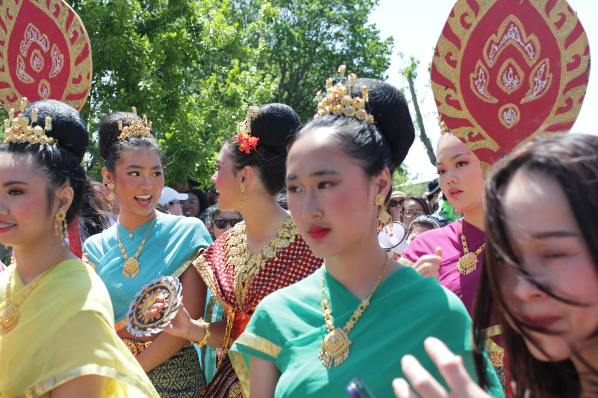 Songkran Festival performers walk during a parade at the Buddhist Temple of Dallas on Sunday. The Songkran Festival celebrates the Thai New Year and symbolizes good fortune and renewal.