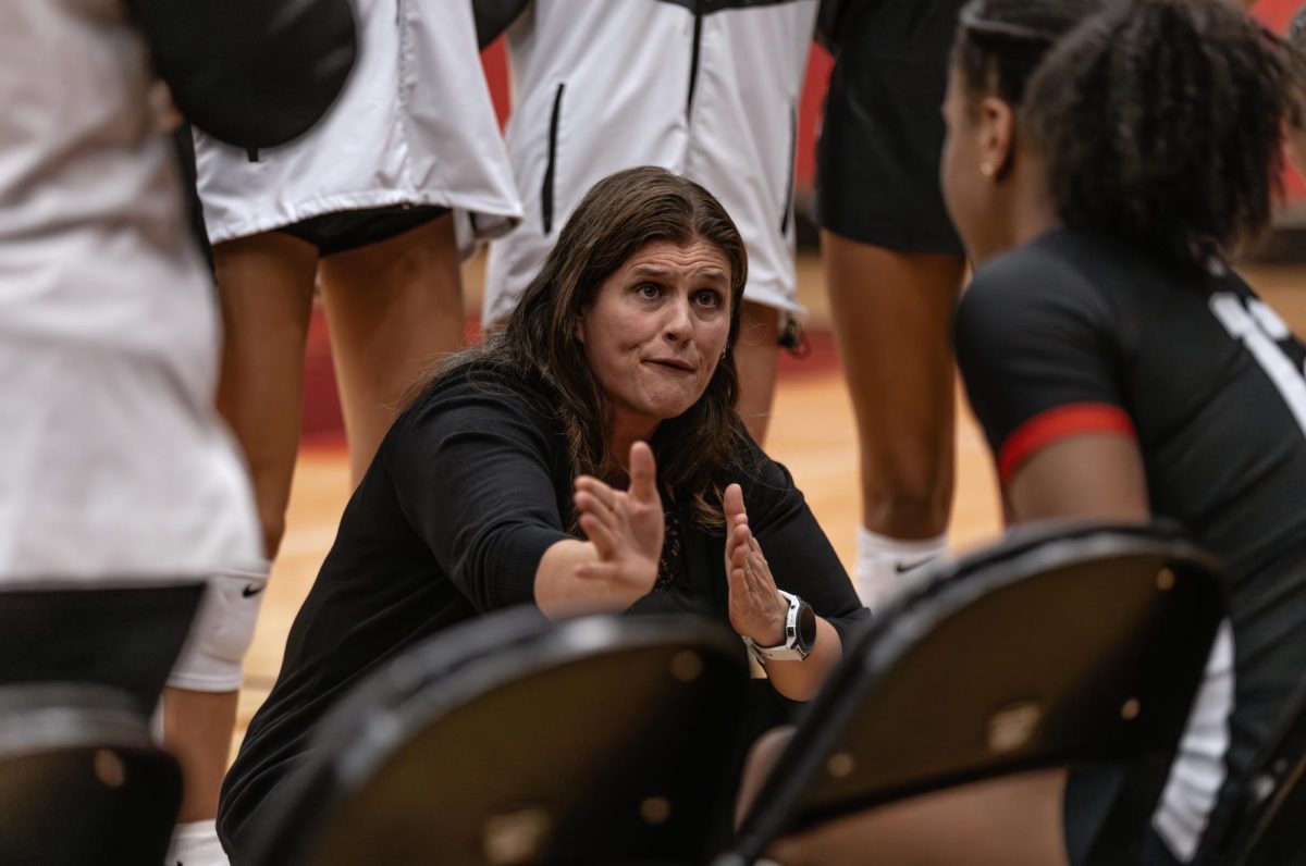 Coppell volleyball  coach Robyn Ross huddles coaches  during a timeout at CHS Arena on Aug. 26 against Richardson. The Cowgirls defeated the Eagles, 3-1. Photo by Naseeha Masood
