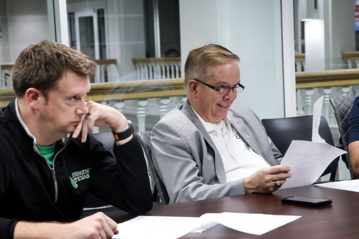 Coppell Mayor Wes Mays views the meeting minutes during the Coppell Recreation Development Corporation Meeting with council member Kevin Nevels. On Monday at Coppell Town Center, the Coppell Recreation Development Corporation meeting included discussion regarding development and management of various public infrastructure projects.