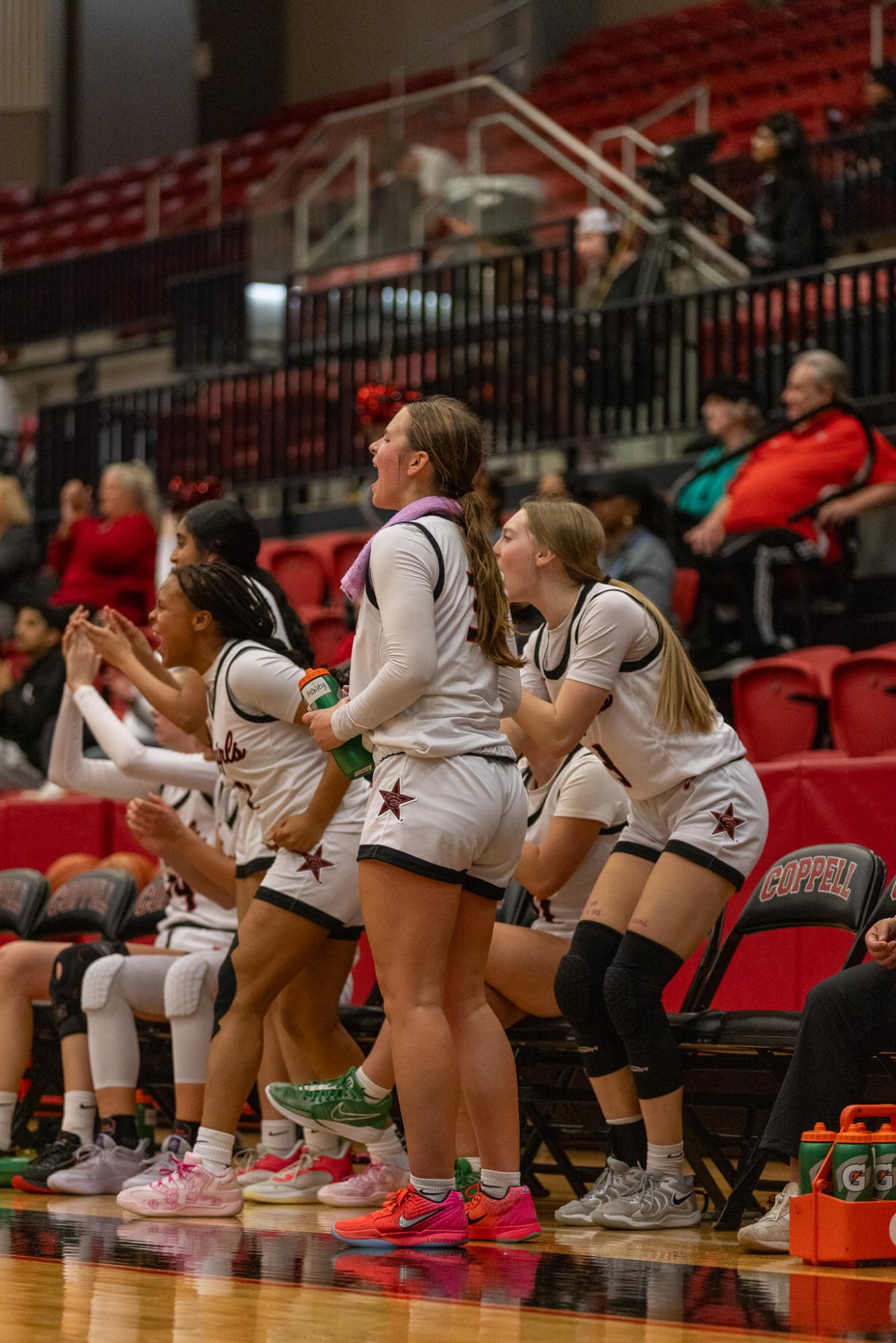Coppell junior Ashley Hall celebrates against Hurst L.D. Bell on Nov. 11 at CHS Arena. The Cowgirls defeated the Blue Raiders, 44-38. 