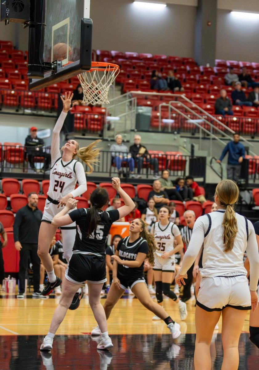 Coppell senior forward Adriana Reijnen goes for a layup against Denton Guyer on Tuesday at CHS Arena. The Cowgirls defeated the Wildcats, 54-51. 