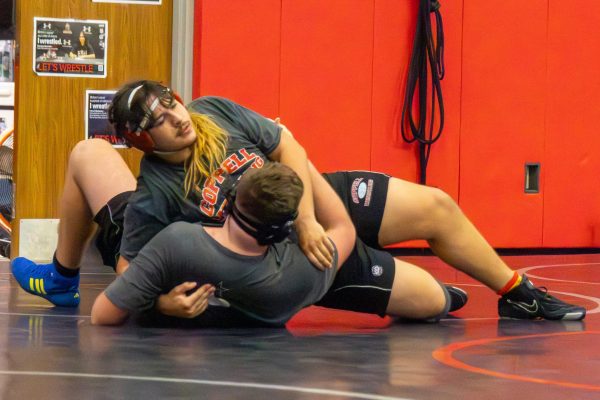 Coppell junior Owen Olvera practices with sophomore Eli Putman on Thursday at CHS Field House. Olvera has been playing football since third grade and wrestling since sophomore year.