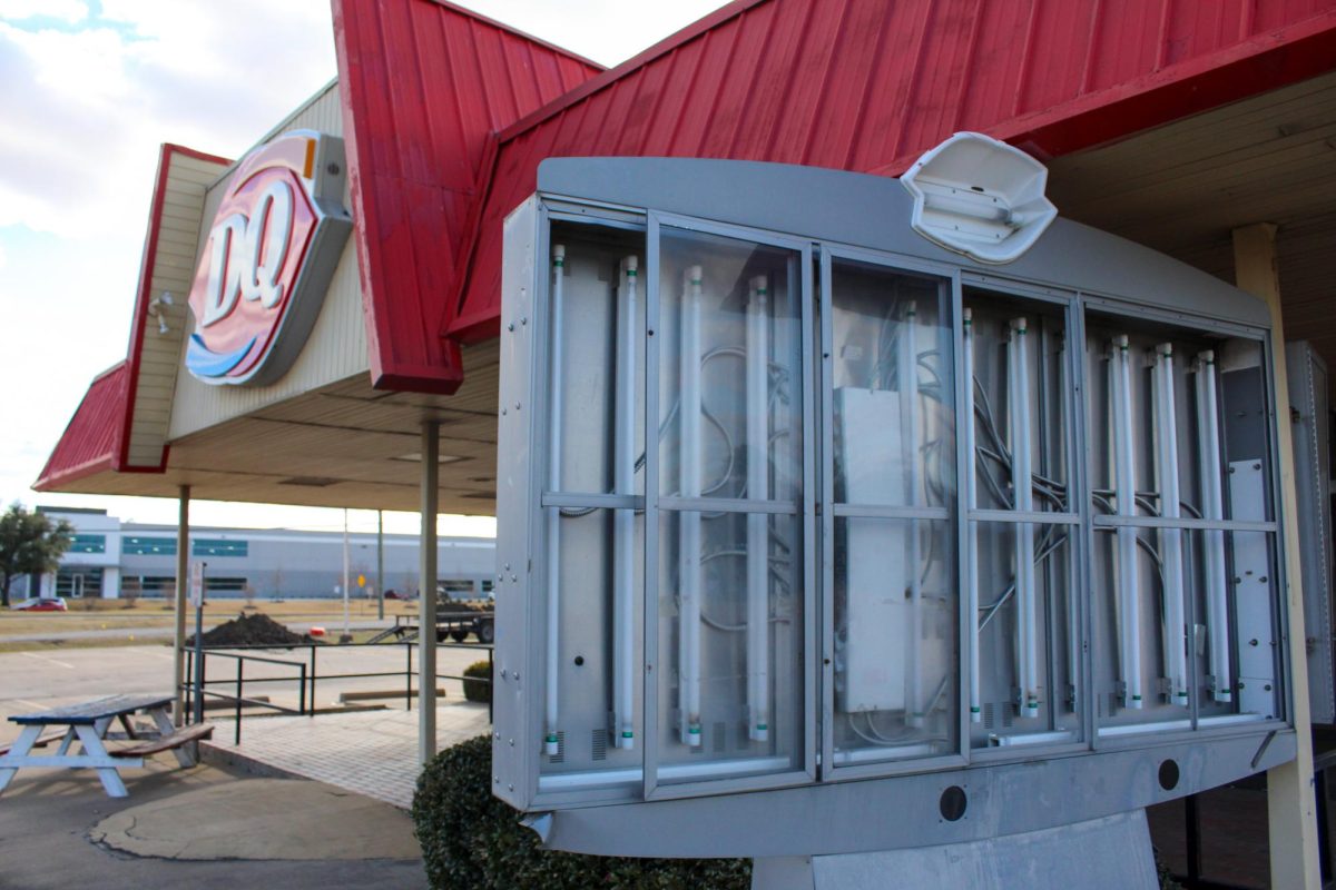 A menu display sits empty at the entrance of the drive-thru lane at the former Coppell Dairy Queen. The Sidekick staff writer Ayaan Haque thinks the closure of the Dairy Queen on Denton Tap Road reflects the slow loss of Coppell’s small-town feel. 