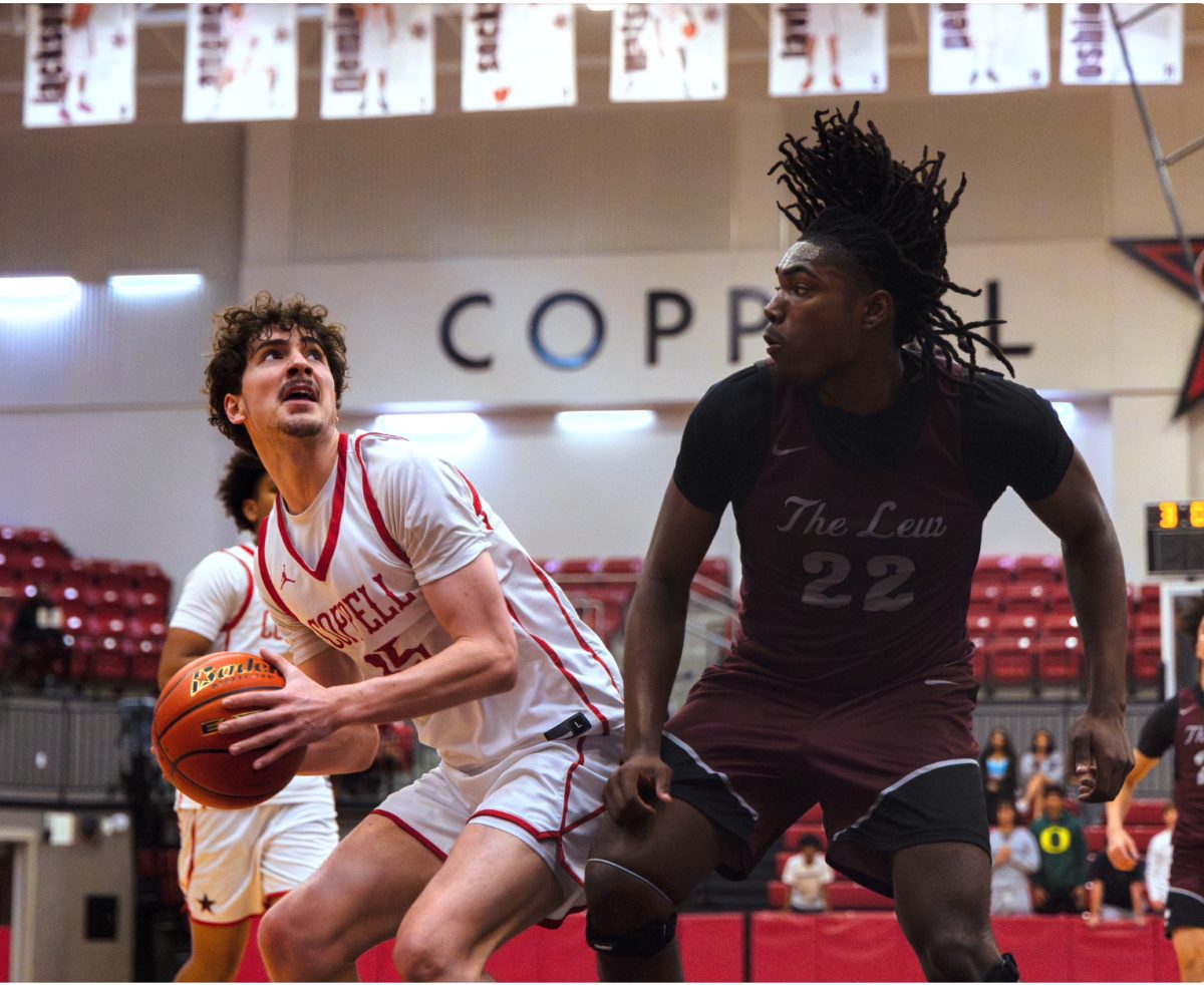 Coppell senior guard Collin Griffith goes for a layup against Lewisville sophomore point forward Caleb Brewer on Tuesday at CHS Arena. The Cowboys defeated the Farmers, 71-65. Photo by Naseeha Masood. 
Coppell senior guard Collin Griffith goes for a layup against Lewisville on Tuesday at CHS Arena. The Cowboys defeated the Farmers, 71-65. Photo by Naseeha Masood. 
