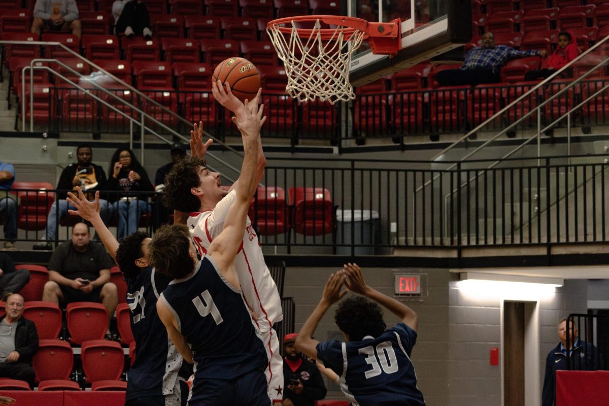 Coppell senior guard Collin Griffith shoots a lay up against Flower Mound on Tuesday at the CHS Arena. The Cowboys defeated the Jaguars 70-64.