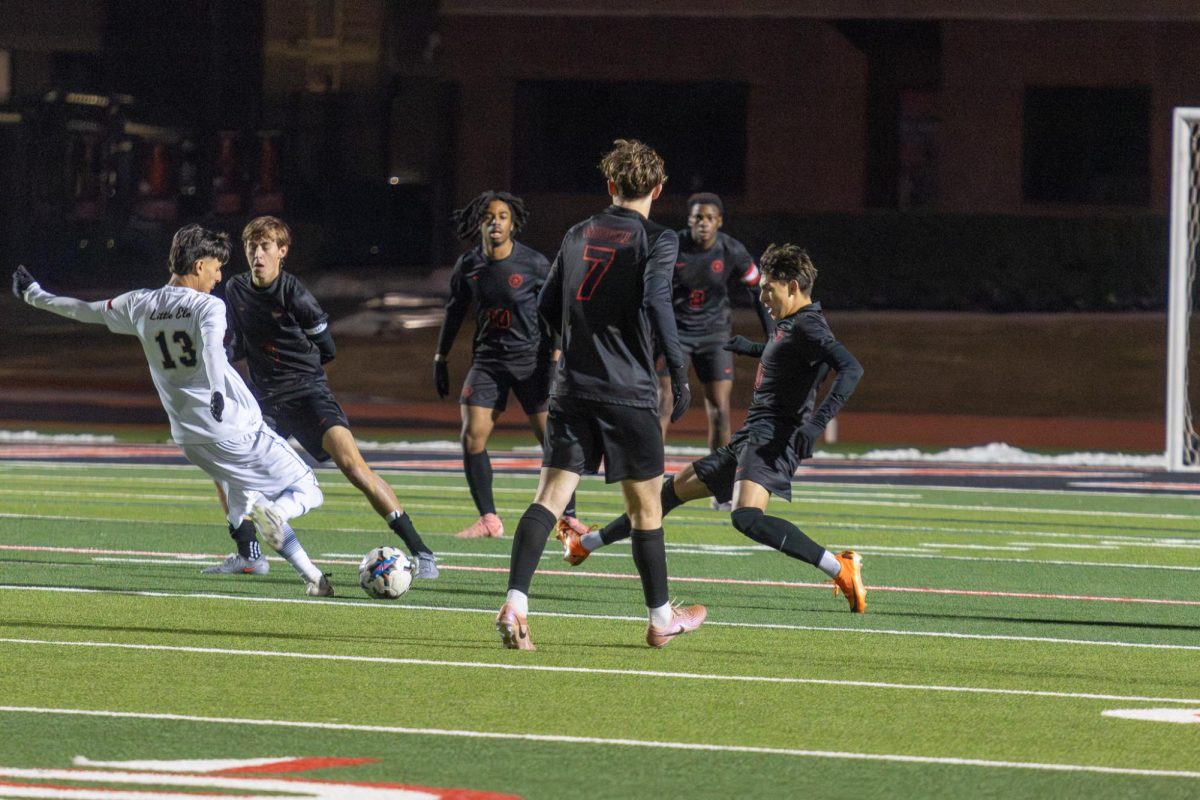Coppell freshmen midfielder Zianni Johnson blocks a shot against Little Elm on Thursday at Buddy Echols Field. The Cowboys defeated the Lobos, 2-1. Photo by Naila Ali