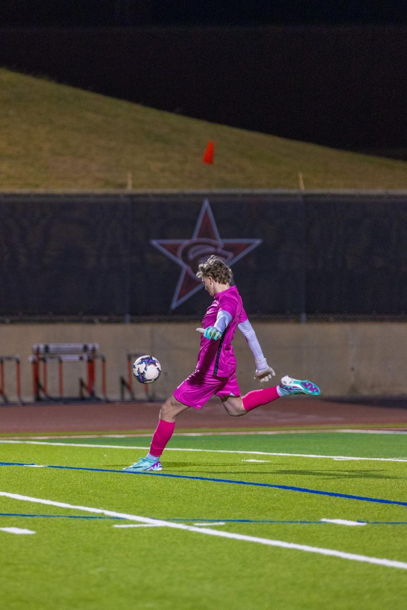 Coppell junior goalkeeper Andrew Telling punts against Lake Highlands on Jan. 16 at Buddy Echols Field. Telling works to keep a positive mindset and clear head going into every match.