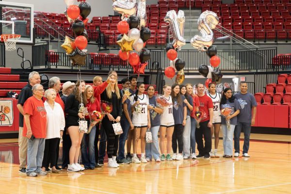 Coppell girls basketball seniors and their family members commemorate the final home game of the regular season with Senior Night at CHS Arena on Feb. 10. Flower Mound Marcus defeated Coppell, 57-35.