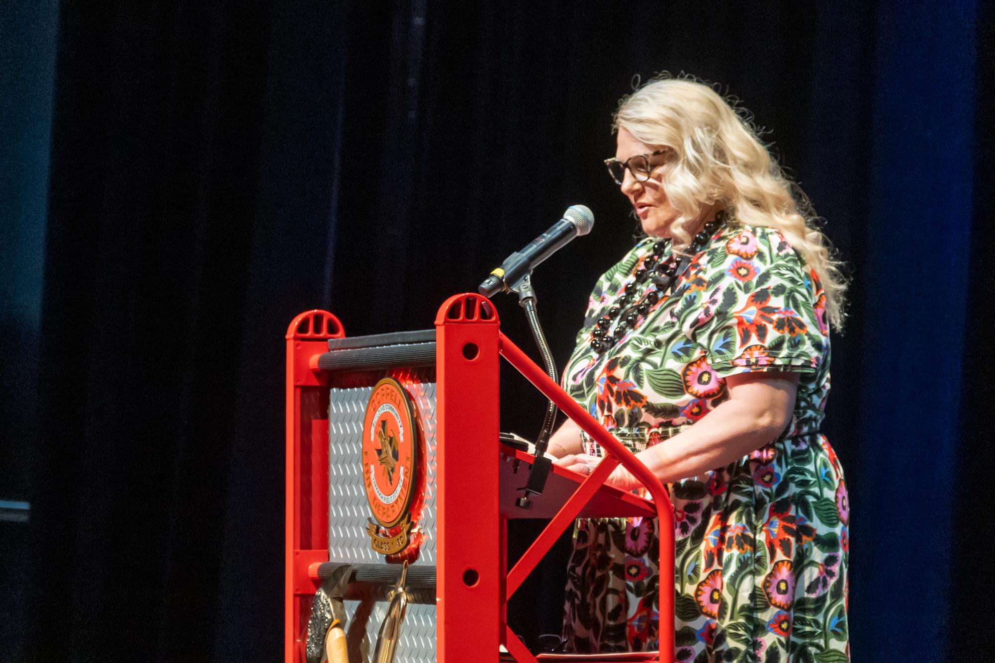 Karla Richardson, wife of Coppell Fire Department Chief Kevin Richardson, speaks about her husband’s strength at home and the station at his retirement ceremony at The Coppell Arts Center on Tuesday. After serving as the Coppell Fire Department’s Chief for two decades, Richardson’s last day is Friday. 