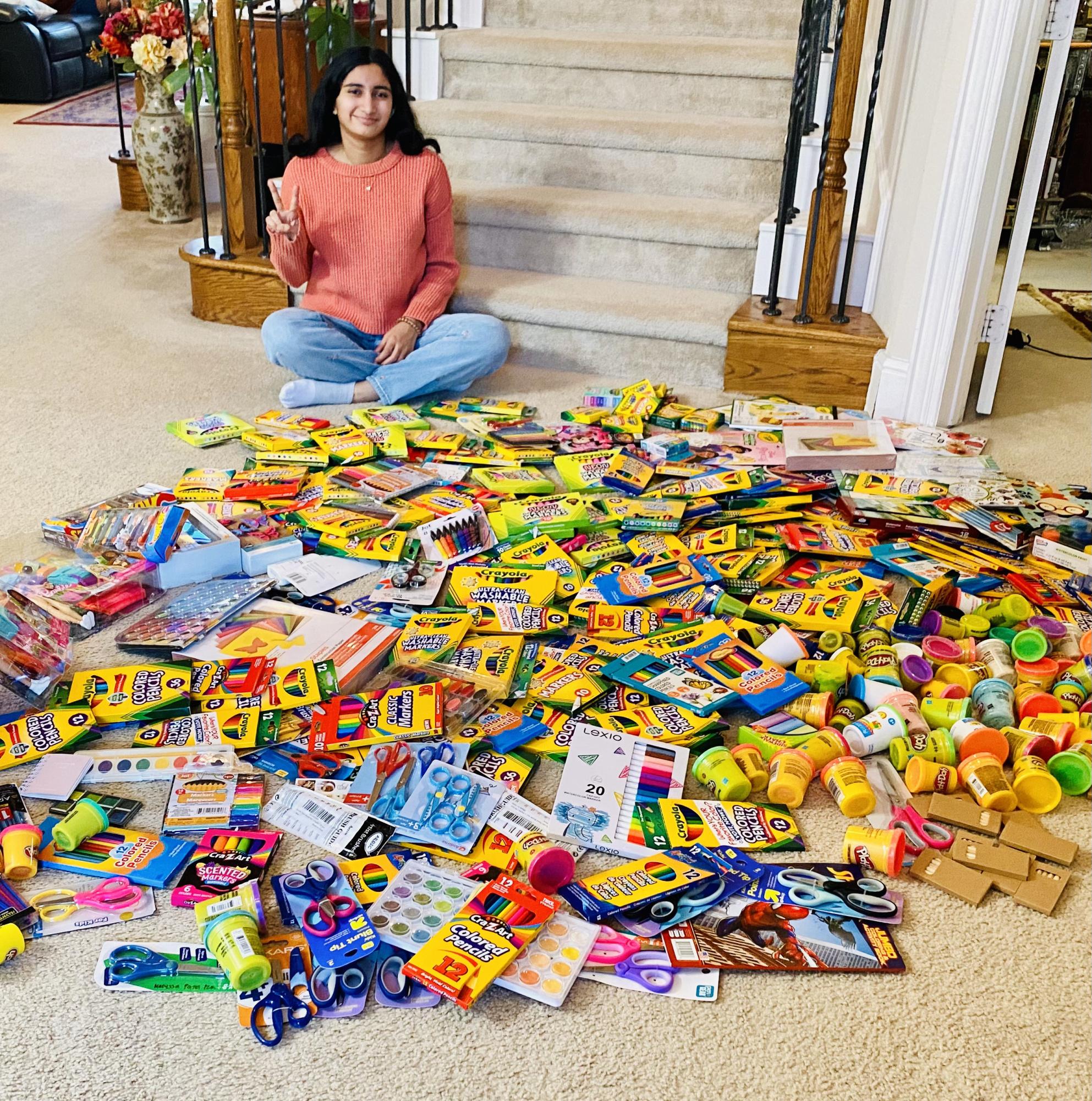 Coppell High School senior Siri Vemireddy displays more than 320 art supplies donated through a Christmas drive on Dec. 18. SmilesThruArt is a student-led organization that brings art therapy and creative activities to children in hospitals. Photo courtesy Siri Vemireddy