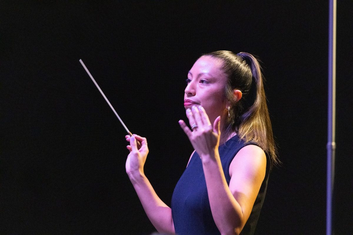 Coppell High School assistant band director Kate McCutcheon conducts “Revival” by John P. Sousa with the CHS9 Symphonic Band on Feb. 9 in the Coppell High School Auditorium. The concert was a unique performance as CHS bands featured music not included at its upcoming UIL competitions.