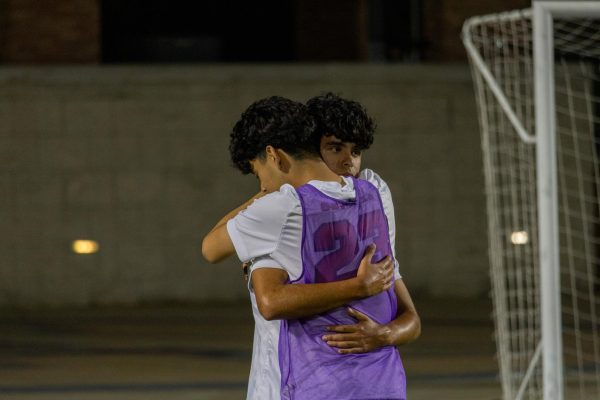 Coppell senior forward Sebastian Duran and sophomore defender Mateo De La Hoya embrace after the match against Lake Highlands on Tuesday at Eagle Stadium in Allen. The Wildcats defeated the Cowboys, 2-1, in Class 6A Division I area playoffs.