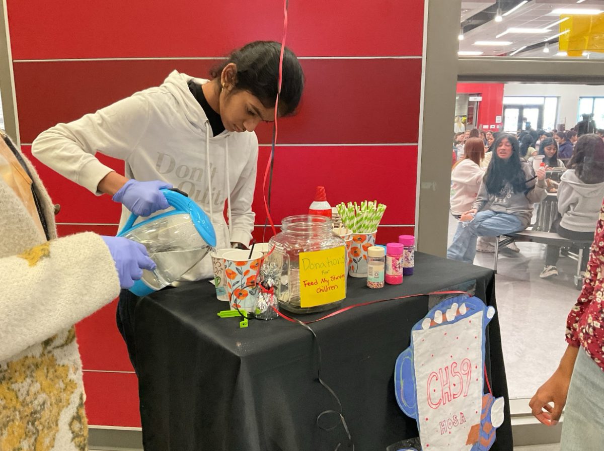 CHS9 student Shresta Sikilammetla prepares hot cocoa for HOSA drive outside of the cafeteria on Feb 11. CHS9 HOSA brings warm spirits with hot cocoa while collecting funds for Feed My Starving Children. 
