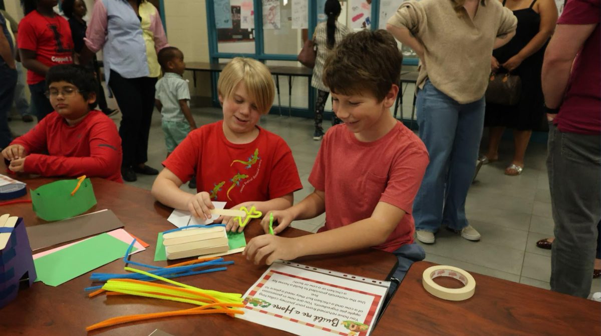 Lakeside Elementary School fourth graders Joseph Callen and Sam Seegmiller work on building a house out of popsicle sticks and pipe cleaners. Lakeside Elementary School. Lakeside Elementary hosted STEAM Night for fourth graders to explore interests in building creations and art. 