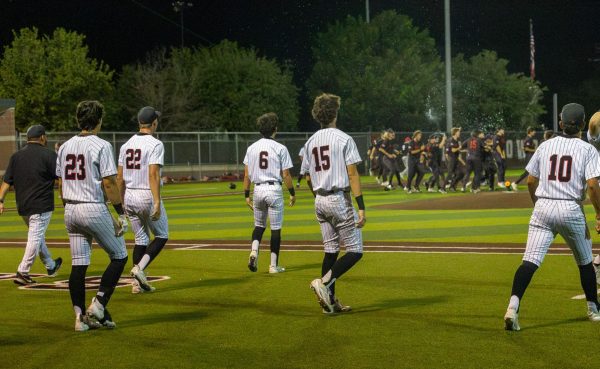 The Flower Mound Marcus baseball team celebrates Coppell’s final out in the bottom of the seventh inning on Friday at Coppell ISD Baseball/Softball Complex. The Marauders defeated the Cowboys, 5-3, ending their season. Photo by Rachel Chio