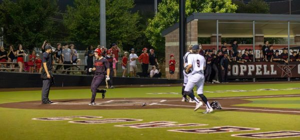 Flower Mound Marcus senior Austin Allen scores against Coppell during the top of the seventh inning on Friday at Coppell ISD Baseball/Softball Complex. The Marauders defeated the Cowboys, 5-3, ending their season. 