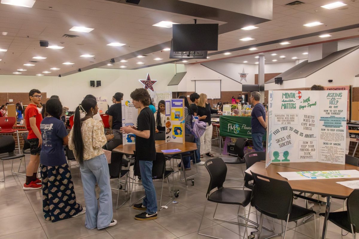 Various booths hold informational conversations regarding different mental health aspects and healthy lifestyle practices on Wednesday in the Coppell High School Commons. The Defensive Line, a nonprofit aiming to prevent youth suicide, and Hope Squad held its annual Mental Health Fair.