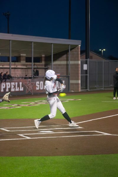 Coppell junior outfielder Cortney Hargrove bats against Hebron on March 27 at Coppell ISD Baseball/Softball Complex. The Hawks defeated the Cowgirls, 7-3.