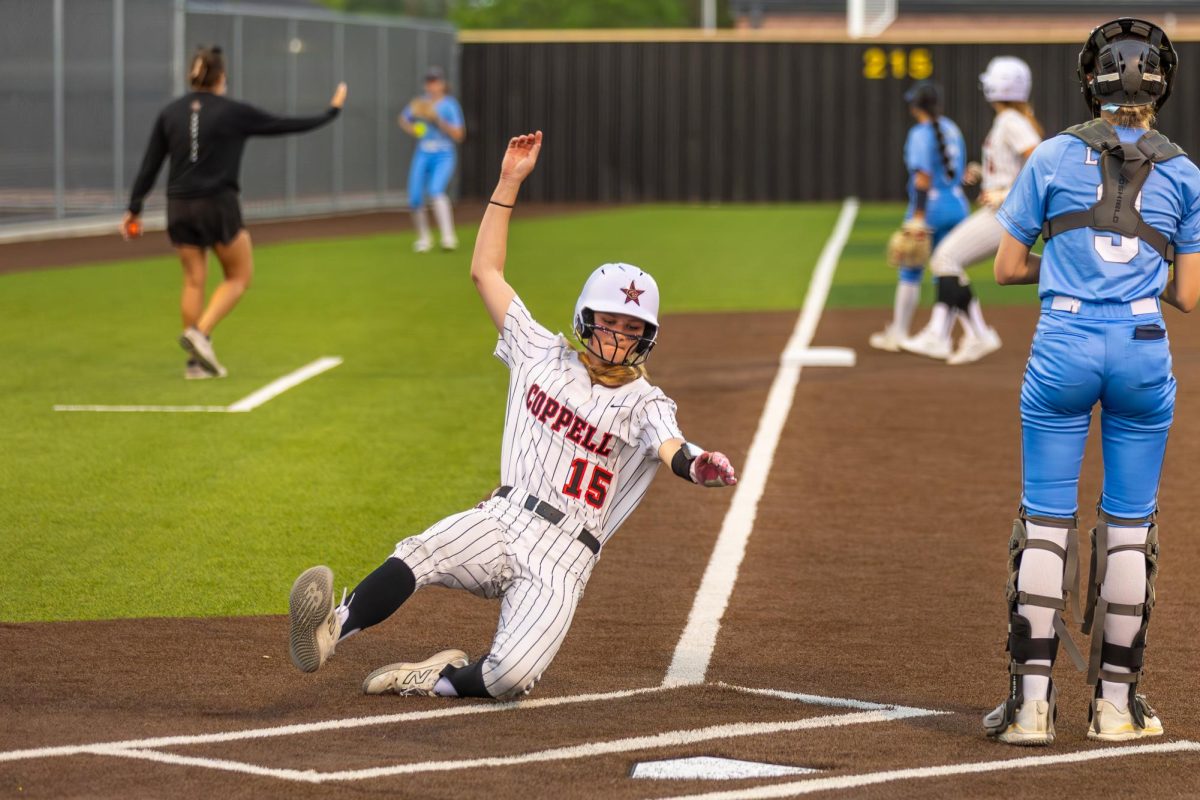 Coppell senior infielder Madison Scott scores a run in the third inning against Little Elm on Thursday at the Coppell ISD Softball/Baseball Complex. The Cowgirls defeated the Lobos, 5-2.