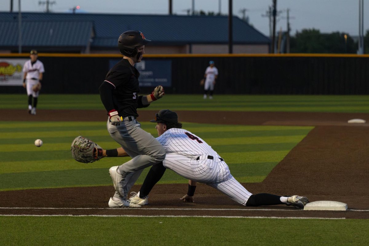 Coppell senior infielder Cade Slatos stretches a putout against Denton Braswell senior Caleb Gardner seconds at Coppell ISD Baseball/Softball Complex. The Cowboys defeated the Bengals, 7-0. 