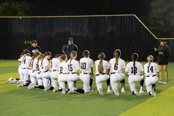 The Coppell softball team listens to coach Emily Janiek at CISD Softball/Baseball Complex after its game against Flower Mound Marcus on Friday. The Lady Marauders defeated the Cowgirls 7-1.
