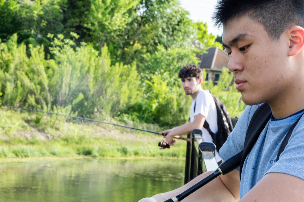 Coppell High School juniors Tony Zhang and Santiago Mendoza wait for fish to bite on April 16 at Moore Road Park. Zhang and Mendoza built a strong friendship through their shared passion for bass fishing.